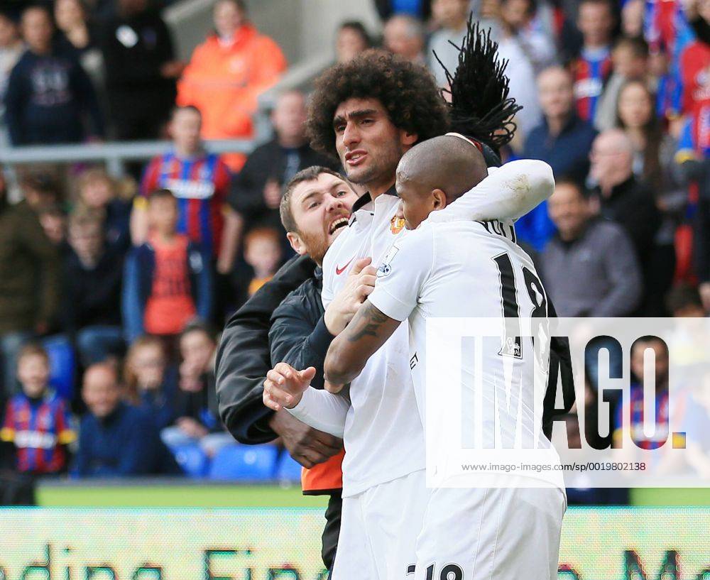 Manchester United ManU s Marouane Fellaini celebrates scoring his sides second goal as fans invade the pitch Barclays Premier League - Crystal Palace vs Manchester United- Selhurst Park - England - 9th May 2015 - Picture David Klein Sportimage .