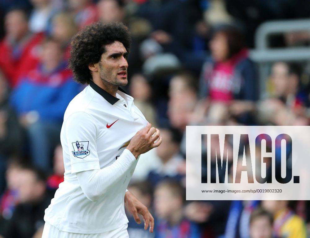Manchester United ManU s Marouane Fellaini celebrates scoring his sides second goal as fans invade the pitch Barclays Premier League - Crystal Palace vs Manchester United- Selhurst Park - England - 9th May 2015 - Picture David Klein Sportimage .