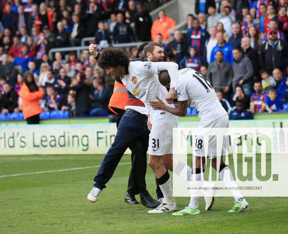 Manchester United ManU s Marouane Fellaini celebrates scoring his sides second goal as fans invade the pitch Barclays Premier League - Crystal Palace vs Manchester United- Selhurst Park - England - 9th May 2015 - Picture David Klein Sportimage .