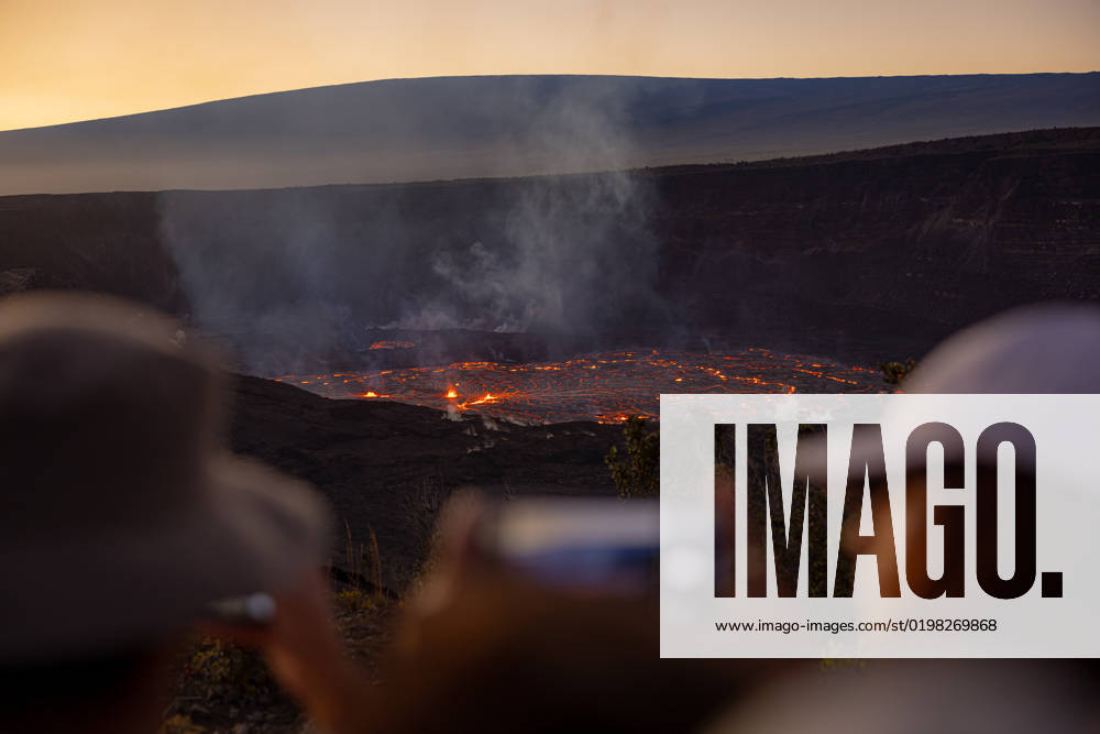 VOLCANO, HI - January 7, 2023: Spectators observe the eruption pictured as Hawaii?s Kilauea volcano eruption continued after re-erupting on January 5th in Volcano, HI on January 7, 2023.