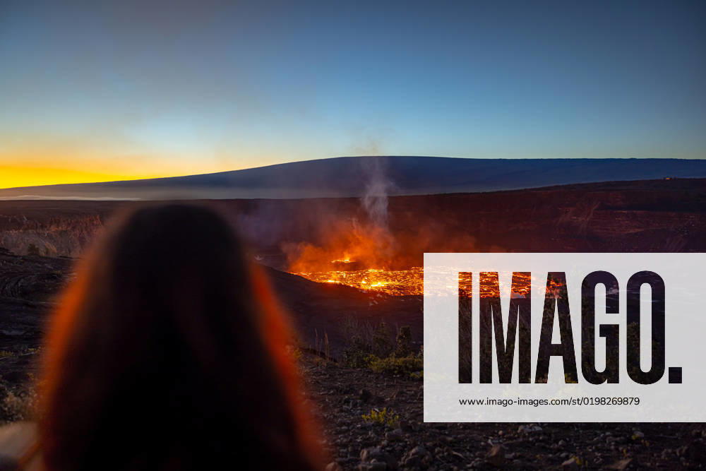 VOLCANO, HI - January 7, 2023: Spectators observe the eruption pictured as Hawaii?s Kilauea volcano eruption continued after re-erupting on January 5th in Volcano, HI on January 7, 2023.