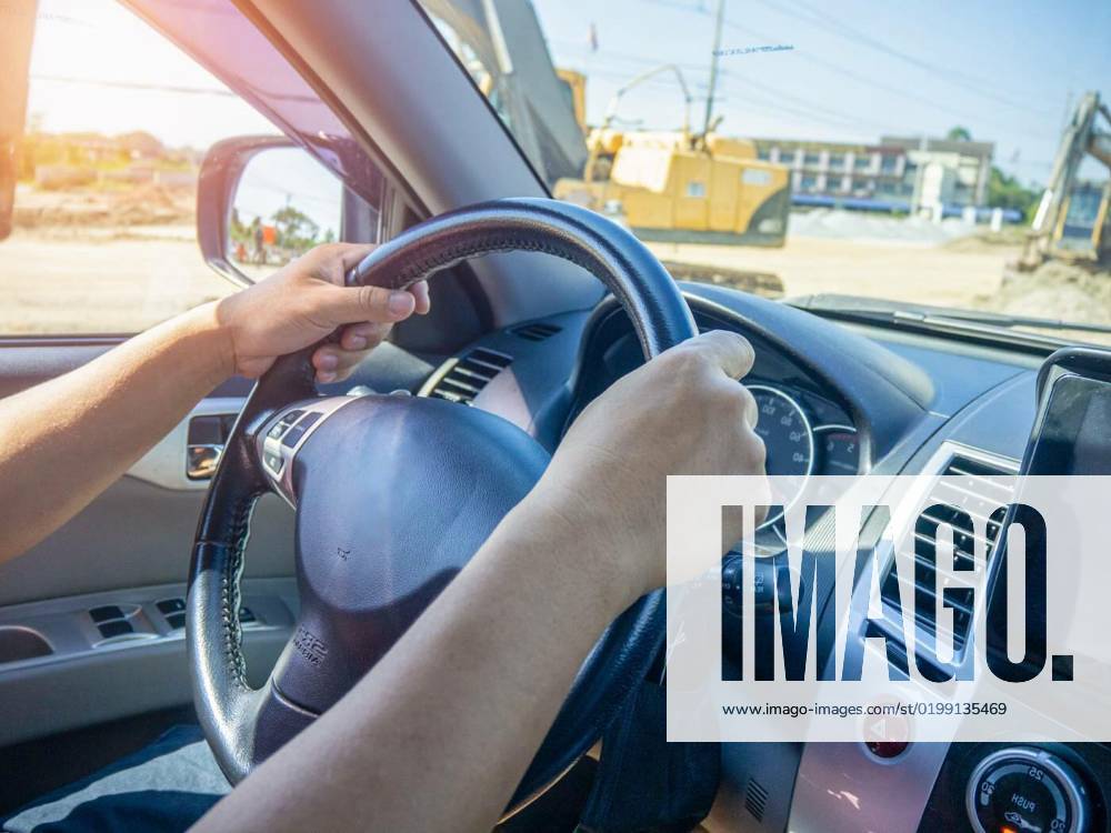 A man s hand held the steering wheel of a car to steer while the car was moving away. Concept and direction of business operations according to the plan. Direction control concept., A man s hand held the steering wheel of a car to steer while the car was moving away. Concept and direction of business operations according to the plan. Direction control concept., A man s hand held the steering wheel of a car to steer while the car was moving away. Concept and direction of business operations according to the plan. Direction control concept., 22.12.2022,