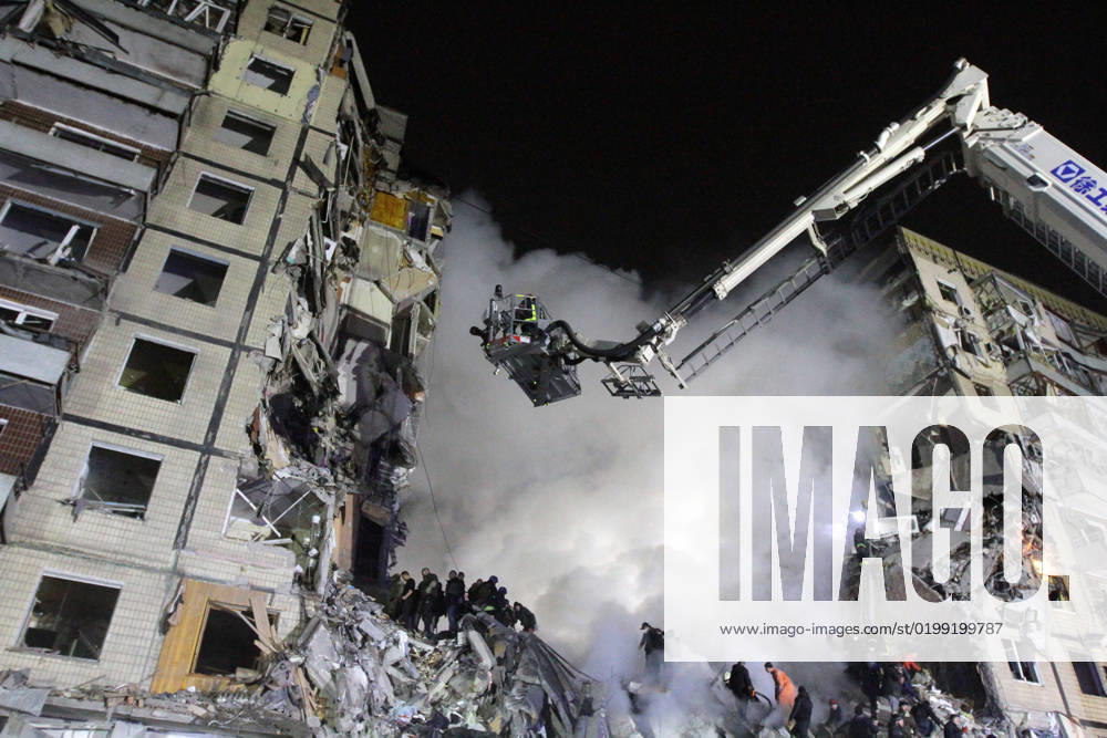 DNIPRO, UKRAINE - JANUARY 14, 2023 - A response effort is underway at a section of an apartment block hit by a rocket launched by Russian occupiers during a massive missile attack on Ukraine earlier Saturday, Dnipro, central Ukraine. As reported, 10 people, including a 15-year-old girl, were killed. Consequences of Russian rocket attack on apartment block in Dnipro