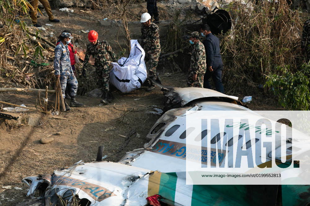 Rescuers recover the body of a victim who died in a Yeti Airlines plane crash in Pokhara. Nepal observed a day of mourning for the victims of the nation s deadliest aviation disaster in three decades, with 72 people confirmed killed in the plane crash. Pokhara Nepal - ZUMAs197 20230116_zaa_s197_044