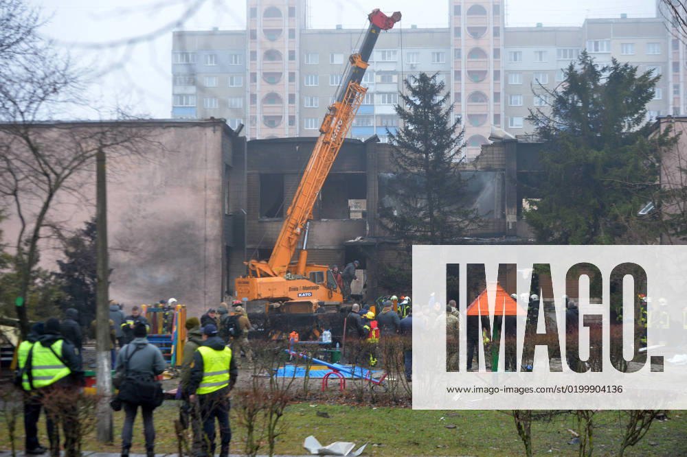 BROVARY, UKRAINE - JANUARY 18, 2023 - Rescuers remove the rubble at the scene of the fatal helicopter crash at a kindergarten in Brovary, Kyiv Region, northern Ukraine. As reported, 16 people, including three children, died and 30 people were admitted to hospital. All nine people onboard - six members of the operative group of the Ministry of Internal Affairs, including Minister Denys Monastyrskyy, and three crewmembers of the State Emergency Service ? are among the dead. Deadly helicopter crash in Brovary