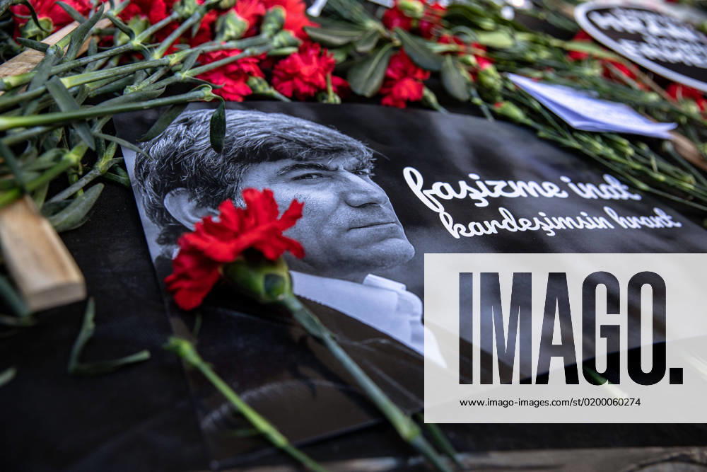 A placard and carnation with his photograph seen at the place where Hrant Dink was killed. People gather for a commemoration ceremony within the 16th death anniversary of Hrant Dink, former editor-in-chief of the bilingual Turkish-Armenian newspaper Agos, in front of the Agos newspaper building in Istanbul. He was assassinated in front of the Agos newspaper building in Istanbul in 2007. Istanbul Turkey - ZUMAs197 20230119_zaa_s197_339