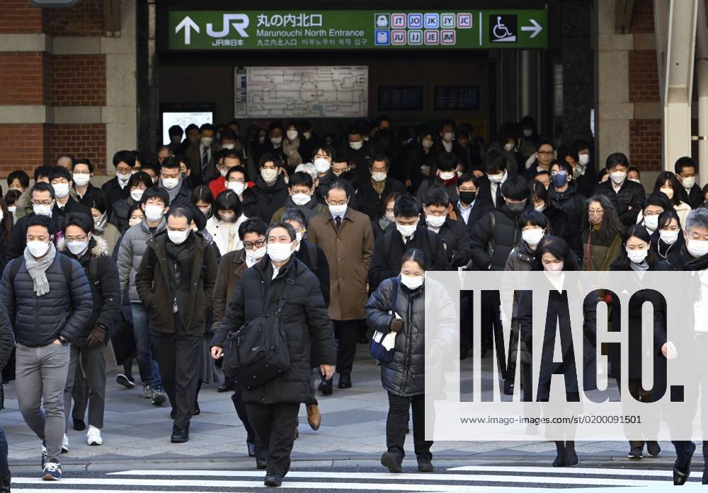 Scene of Tokyo People wearing face masks walk in front of JR Tokyo Station in the Japanese capital during the morning commuting hours of Jan. 20, 2023, amid the spread of coronavirus infections. A14AA0001386453P