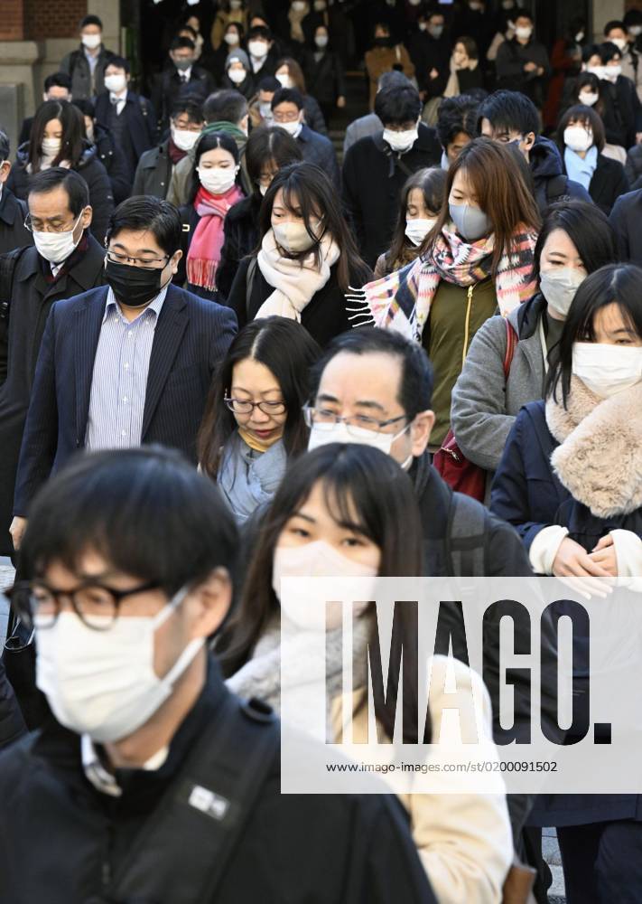 Scene of Tokyo People wearing face masks walk in front of JR Tokyo Station in the Japanese capital during the morning commuting hours of Jan. 20, 2023, amid the spread of coronavirus infections. A14AA0001386454P