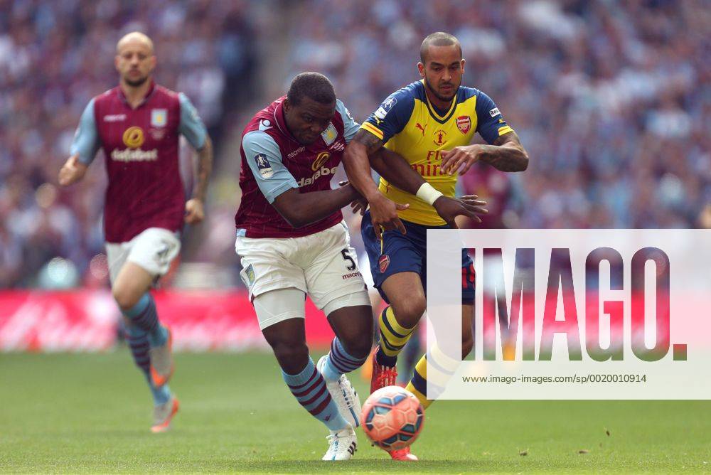 Jores Okore of Aston Villa battles Arsenal s Theo Walcott - Arsenal vs. Aston Villa - FA Cup Final - Wembley Stadium - London - 30 05 2015 Pic Philip Oldham Sportimage .