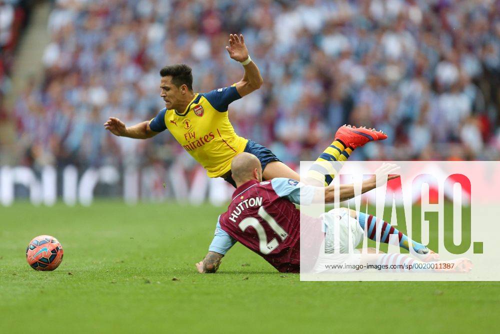 Alan Hutton of Aston Villa puts in a challenge on Arsenal s Alexis Sanchez - Arsenal vs. Aston Villa - FA Cup Final - Wembley Stadium - London - 30 05 2015 Pic Philip Oldham Sportimage .