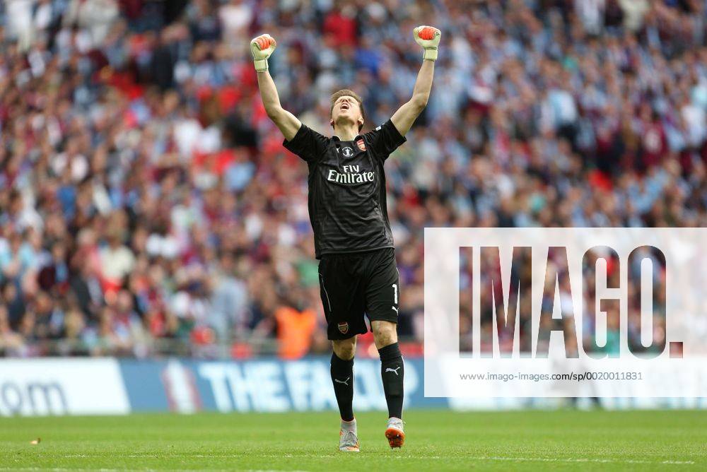 Arsenal s Wojciech Szczesny celebrates his sides second goal - Arsenal vs. Aston Villa - FA Cup Final - Wembley Stadium - London - 30 05 2015 Pic Philip Oldham Sportimage .