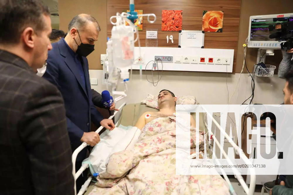 Iranian Foreign Minister Hossein Amir-Abdollahian visits an Azerbaijani embassy guard who was wounded as a gunman attacked the Azerbaijani Embassy at Tajrish Shohada Hospital in northern Tehran, Iran, Jan. 27, 2023. A gunman stormed the Azerbaijan Embassy in Iran s capital Friday, killing its security chief and wounding two guards in an attack that spiked long-simmering tensions between the two neighboring countries. Concerned Iranian officials are seriously pursuing the issue and the attacker is arrested and is being interrogated. Tehran Iran - ZUMAi98_ 20230128_zih_i98_002