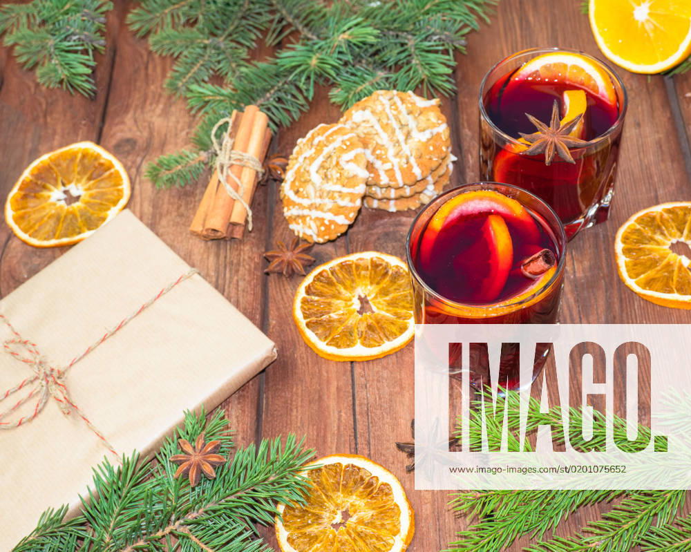 Mulled wine and spices on a wooden background with branches of a Christmas tree. Selective focus. , 41047686.jpg, christmas, newyear, wine, cinnamon, drink, anise, glass, spice, cup, holiday, red, fruit, hot, sweet, warm, wooden, traditional, decoration, food, alcohol, clove, mulled, homemade, delicious, winter, orange, star, beverage, punch, aromatic, flavor, aroma, seasonal, spruce, advent, lighting, season, slice, grog, xmas, heat, lemon, mug, mulled wine, nobody, bright, wood, selective focus, stick, vertical