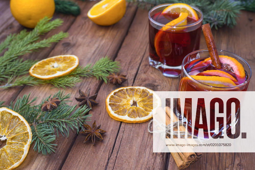 Mulled wine and spices on a wooden background with branches of a Christmas tree. Selective focus. , 41051558.jpg, christmas, newyear, wine, cinnamon, drink, anise, glass, spice, cup, holiday, red, fruit, hot, sweet, warm, wooden, traditional, decoration, food, alcohol, clove, mulled, homemade, delicious, winter, orange, star, beverage, punch, aromatic, flavor, aroma, seasonal, spruce, advent, lighting, season, slice, grog, xmas, heat, lemon, mug, mulled wine, nobody, bright, wood, selective focus, stick, vertical