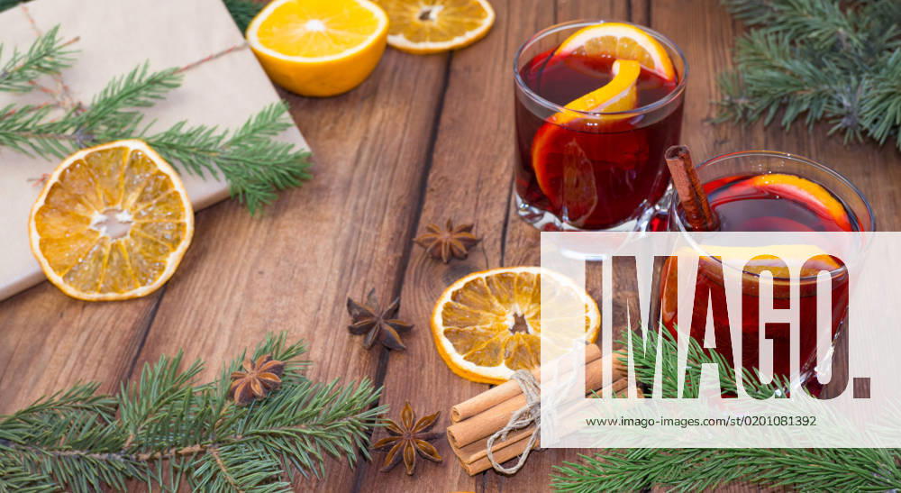 Mulled wine and spices on a wooden background with branches of a Christmas tree. Selective focus. , 41145398.jpg, christmas, newyear, wine, cinnamon, drink, anise, glass, spice, cup, holiday, red, fruit, hot, sweet, warm, wooden, traditional, decoration, food, alcohol, clove, mulled, homemade, delicious, winter, orange, star, beverage, punch, aromatic, flavor, aroma, seasonal, spruce, advent, lighting, season, slice, grog, xmas, heat, lemon, mug, mulled wine, nobody, bright, wood, selective focus, stick, vertical