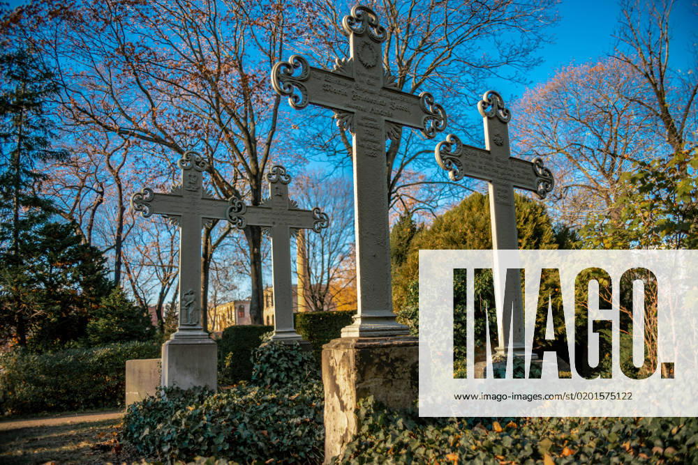 Old weathered crosses on a german graveyard in Berlin Old weathered crosses on a german graveyard in Berlin on a bright winter day