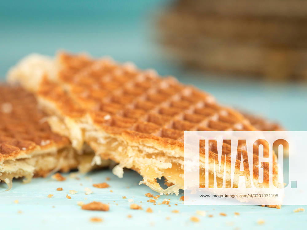 Stroopwafels or caramel Dutch Waffles Stroopwafels or caramel Dutch Waffle close up on turquoise wooden background