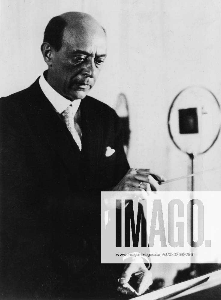 Arnold Schoenberg, Austrian composer Arnold Schoenberg, Austrian composer, teacher of composition, and leader of the Second Viennese School. As a result of Nazi persecution (he was Jewish) he moved to America in 1934, and became an American citizen in 1941. Seen here conducting, possibly for a recording. Date: 1874 - 1951