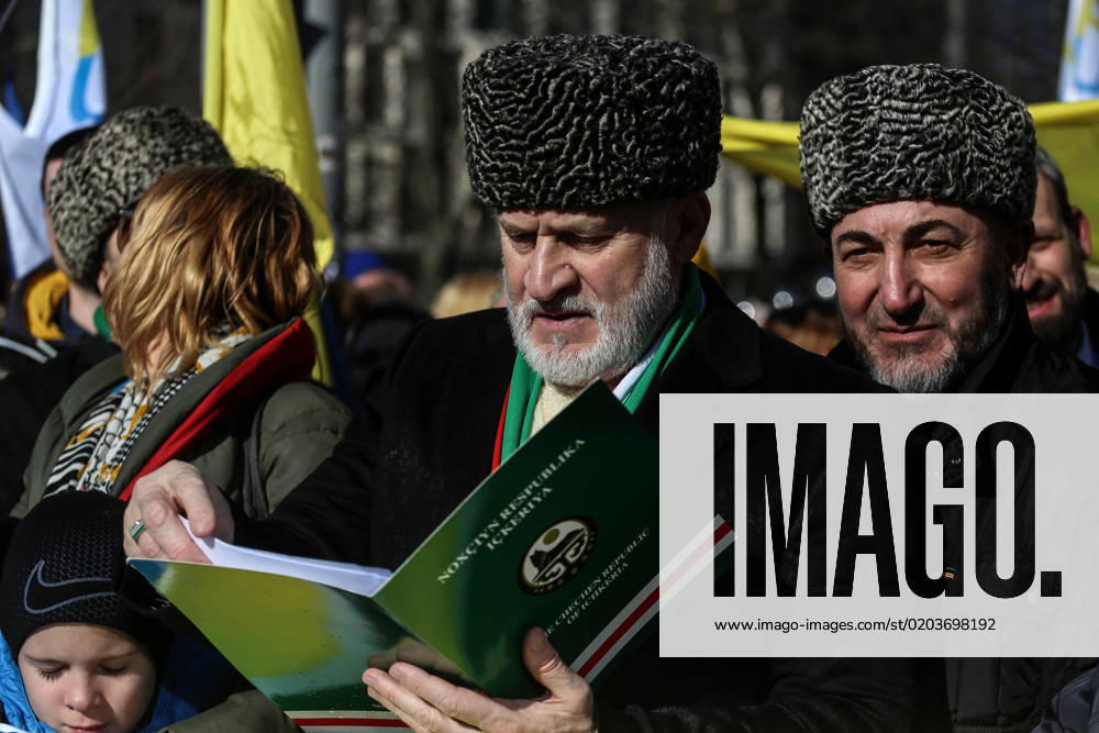 Prime Minister of the government-in-exile of the Chechen Republic of Ichkeria Akhmed Zakaiev, center, takes part in a demonstration in occasion of the one-year anniversary of Russia s invasion of Ukraine in Brussels, Belgium, February 25, 2023. Brussels Belgium - ZUMAm177 20230225_zip_m177_005
