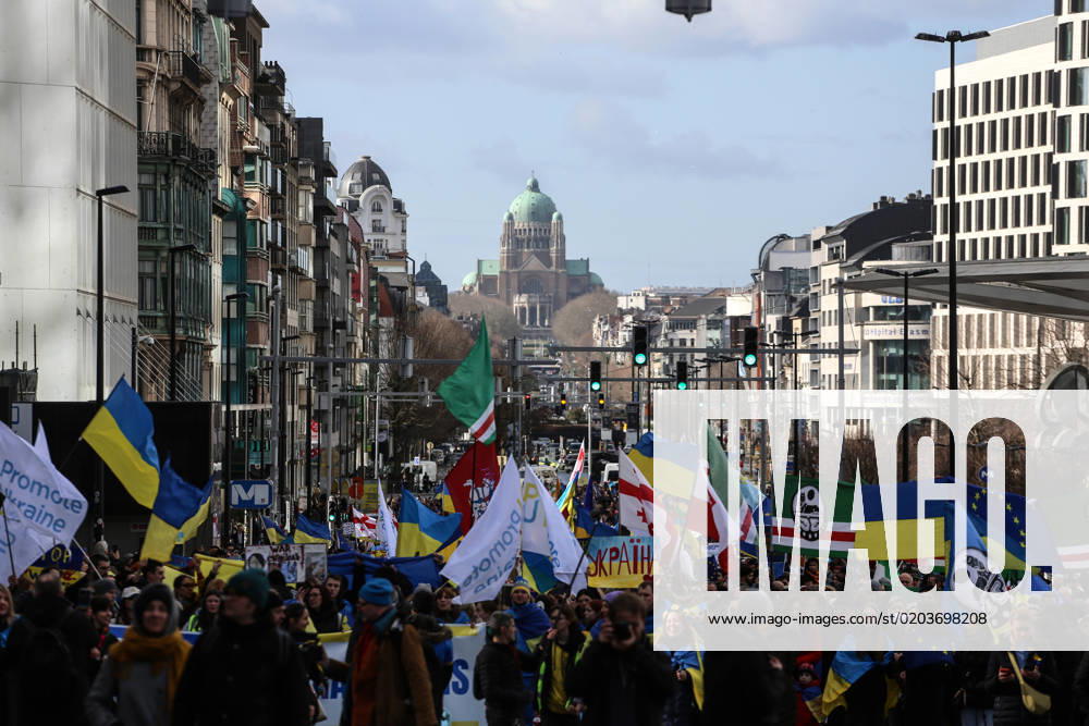People hold signs, Ukrainian and Belarusian flags, and flags of the Chechen Republic of Ichkeria during a demonstration in occasion of the one-year anniversary of Russia s invasion of Ukraine in Brussels, Belgium, February 25, 2023. Brussels Belgium - ZUMAm177 20230225_zip_m177_006