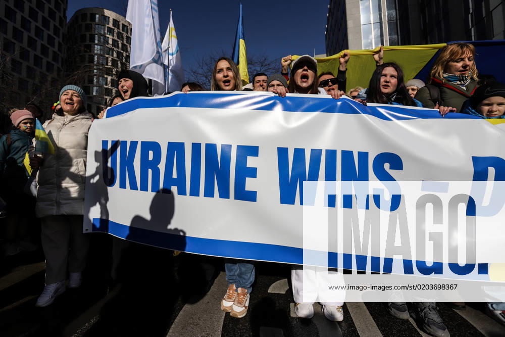 Demonstrators hold a banner reading Ukraine wins during a demonstration in occasion of the one-year anniversary of Russia s invasion of Ukraine in Brussels, Belgium, February 25, 2023. Brussels Belgium - ZUMAm177 20230225_zip_m177_020