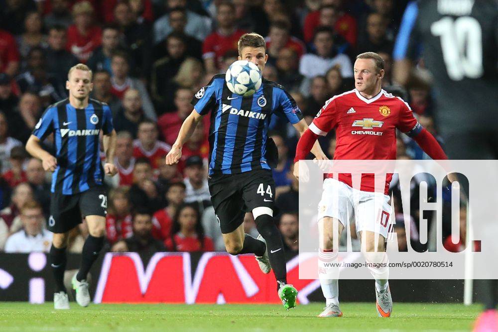 - MANCHESTER, UNITED KINGDOM: Club s Brandon Mechele and Manchester s Wayne Rooney fight for the ball during a soccer game between British club Manchester United ManU FC and Belgian team Club Brugge KV in Manchester, United Kingdom, Tuesday 18 August 2015, the first leg of the play-offs for the UEFA Champions League competition. BRUNOxFAHY x04682734x