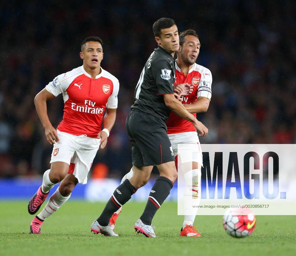 Arsenal s Santi Cazorla tussles with Liverpool s Philippe Coutinho Barclays Premier League - Arsenal vs Liverpool - Emirates Stadium -England - 24th August 2015 - Picture David Klein Sportimage .