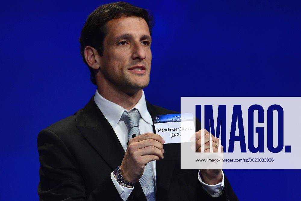 Aug. 27, 2015 - Monaco, Monaco - JULIANO BELLETTI ex Barcelona soccer player shows the draw result of Manchester City FC during the UEFA Champions League Draws 2015 - 16 at Grimaldi Forum. Soccer 2015 - UEFA Champions League 2015 - 16 Draw - ZUMAm119