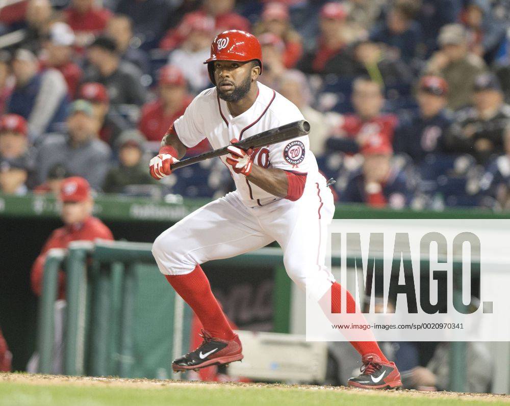 Washington, District Of Columbia, U.S - Washington Nationals center fielder Denard Span (2) lays down a bunt in the eighth inning in the game against the Florida Marlins at Nationals Park in Washington, D.C. on Wednesday, April 9, 2014. He later scored on Jayson Werth s grand slam home run. The Nationals won the game 10 - 7. MLB Baseball Herren USA 2014 - Marlins Beat Nationals 7-1 - ZUMAp124