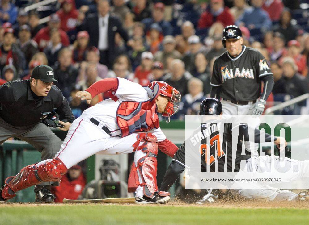 Washington, District Of Columbia, U.S - Miami Marlins right fielder Giancarlo Stanton (27) is tagged out by Washington Nationals catcher Jose Lobaton (59) in the eighth inning of the game at Nationals Park in Washington, D.C. on Wednesday, April 9, 2014. The Nationals won the game 10 - 7. MLB Baseball Herren USA 2014 - Marlins Beat Nationals 7-1 - ZUMAp124