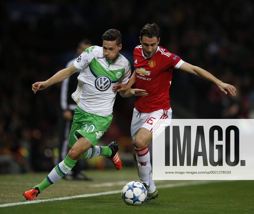 Julian Draxler of Wolfsburg and Matteo Darmian of Manchester United ManU tussle it out - UEFA Champions League - Group B - Manchester Utd vs Vfl Wolfsburg - Old Trafford Stadium - Manchester - England - 30th September 2015 - Picture Simon Bellis Sportimage .