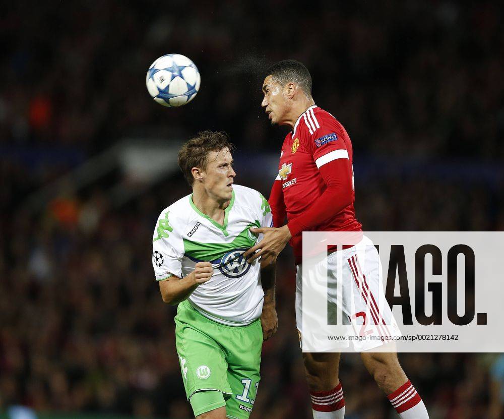 Chris Smalling of Manchester United ManU heads clear from Max Kruse of Wolfsburg - UEFA Champions League - Group B - Manchester Utd vs Vfl Wolfsburg - Old Trafford Stadium - Manchester - England - 30th September 2015 - Picture Simon Bellis Sportimage .