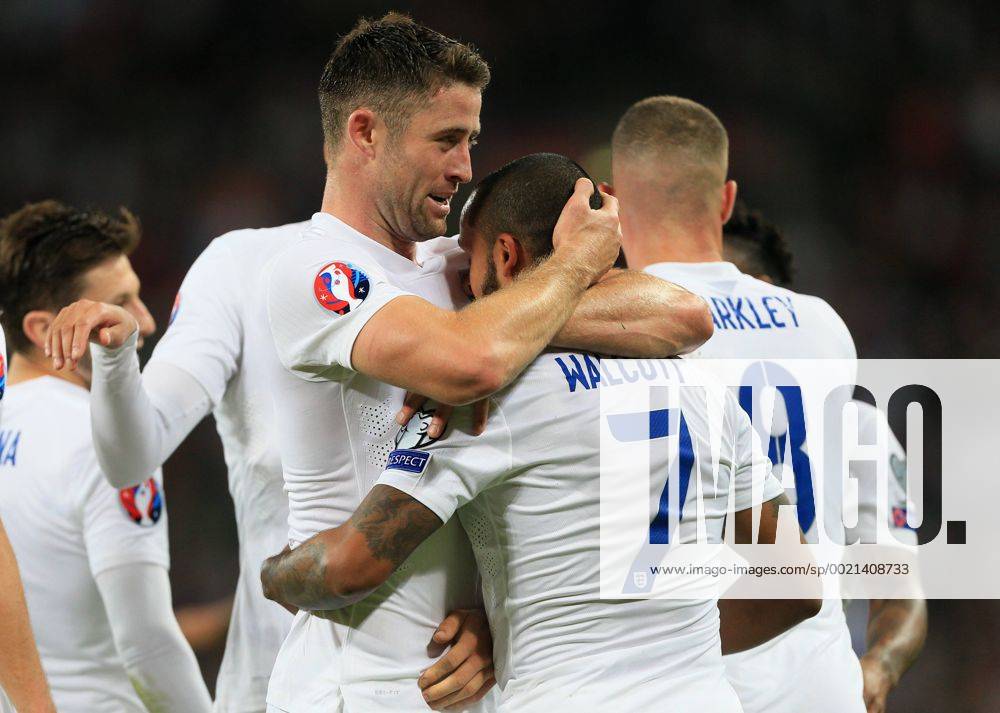 England s Theo Walcott celebrates scoring his sides opening goal with Gary Cahill Euro 2016 Qualifier- England vs Estonia - Wembley Stadium - England - 9th October 2015 - Picture David Klein Sportimage .
