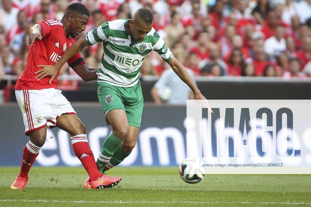 Aug. 31, 2014 - Lisbon, Portugal - Sporting«s forward Islam Slimani (R) challenges Benfica«s defender Eliseu during the Portuguese Liga football match SL Benfica vs Sporting CP at Luz stadium in Lisbon on August 31, 2014. NURPHOTO CARLOS COSTA FBL-LIGA-SPORTING-BENFICA - ZUMAn230