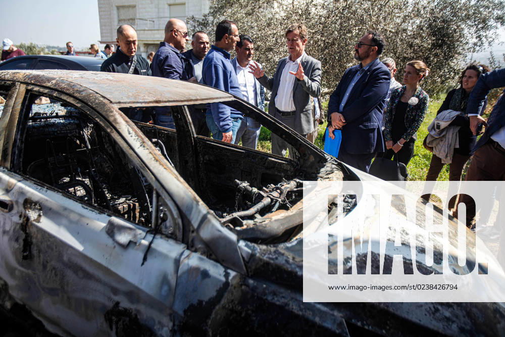 Sven Kuhn von Burgsdorff, the European Union representative for the Palestinian Territories, center, survey the damage of a burnt car in the West Bank town of Hawara which was set ablaze by radical Jewish settlers earlier this week . On Monday scores of Israeli settlers went on a violent rampage in the northern West Bank town of Hawara, setting cars and homes on fire after two settlers were killed by a Palestinian gunman. Nablus Palestine - ZUMAs197 20230303_zaa_s197_316