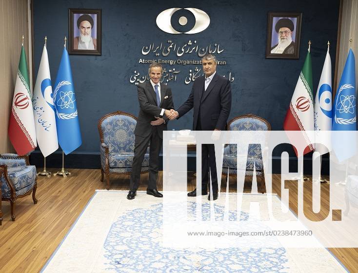 Head of the Atomic Energy Organization of Iran, MOHAMMAD ESLAMI (R), shakes hands with International Atomic Energy Agency (IAEA) chief RAFAEL GROSSI at the start of their meeting in Tehran on March 4, 2023. The UN nuclear watchdog chief was in Iran on March 4 for expected talks with the President and other officials after the discovery of uranium particles enriched to near weapons-grade level. The two-day visit comes as the Vienna-based organisation seeks greater cooperation with Iran over its nuclear activities. Tehran Iran - ZUMAi98_ 20230304_zih_i98_019