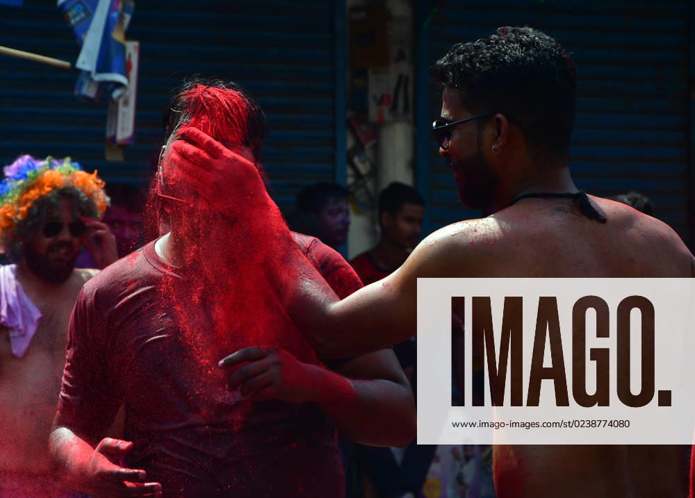 Prayagraj: A youth apply color powder to another face during Holi festival Celebration in Prayagraj on Wednesday, March 08, 2023. Prayagraj India - ZUMAv115 20230308_zap_v115_009