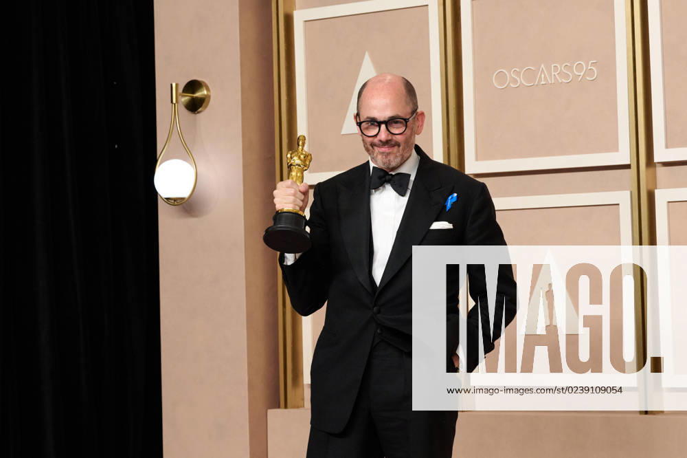Edward Berger poses backstage with the Oscar® for International Feature FIlm during the live ABC telecast of the 95th Oscars® at Dolby® Theatre at Ovation Hollywood on Sunday