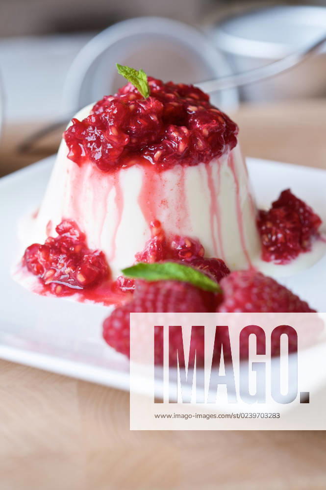 Panna cotta with lemon and buttermilk and fresh raspberries