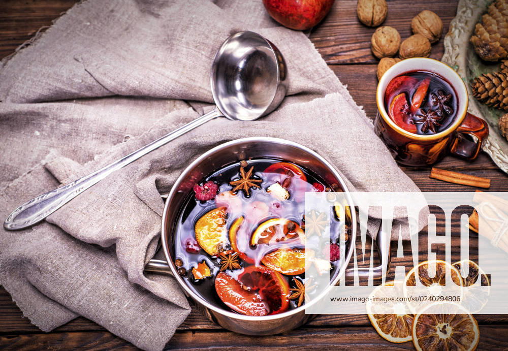 Mulled wine in a saucepan on a brown wooden background, top view , 30783050.jpg, above, alcohol, aluminum, anise, aromatic, background, beverage, casserole, celebration, christmas, cinnamon, citrus, cooking, cuisine, dish, drink, festive, food, grog, holiday, homemade, hot, ingredient, ladle, mulled, nobody, orange, overhead, punch, raspberry, red, rustic, spice, spoon, star, sugar, sweet, table, top view, traditional, vintage, wine, winter, wooden, xmas