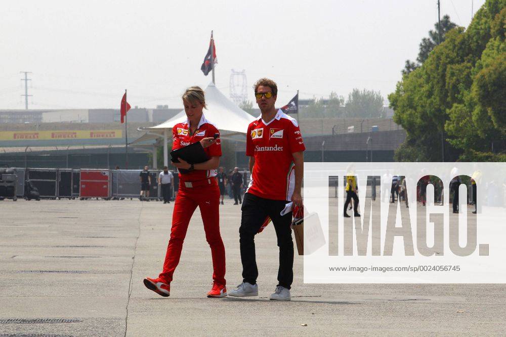 Britta Roeske (AUT) Ferrari Press Officer and Sebastian Vettel (GER) Scuderia Ferrari SF16-H Chinese Grand Prix, Shanghai 14 - 17 April 2016 xPhoto4_s.r.l._769559x