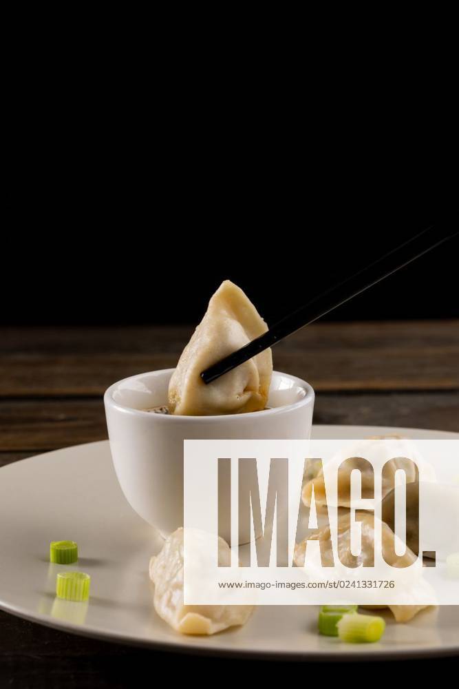 IMAGO Creative, Food, Dumplings Close up of asian dumplings, soy sauce and chopsticks on plate and wooden background Close up of asian dumplings, soy sauce and chopsticks on plate and wooden background. Asian tasty home cooked food and healthy eating., model released, , property released, Cape Town, South Africa, 14.07.2022, 3766923.jpg, close,asian,dumpling,soy sauce,chopstick,plate,wooden background,tasty,home,cooked,food,healthy eating,delicious,meal,gourmet,cuisine,dinner,lunch,dish,fresh,snack,cooking,diet,nutrition,sweet,healthy,dessert,meat,eat,restaurant,vegetable,ingredient,soy,sauce,wooden,background,eating