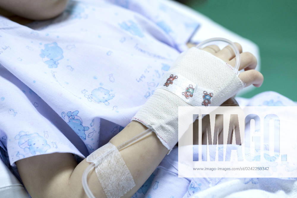Sick child on a receiving a saline solution in hospital , 31713628.jpg, hospital, saline, medical, treatment, hand, child, solution, receiving, patient, drip, sick, bed, intravenous, emergency, healthy, health, girl, equipment, care, medicine, illness, kid, asian, children, young, people, room, white, little, background, baby, female, woman, cute, close, up, cold, clinic, virus, sickness, sleeping, rest, space, surgical, pain, healing, drug, cure, doctor, vein