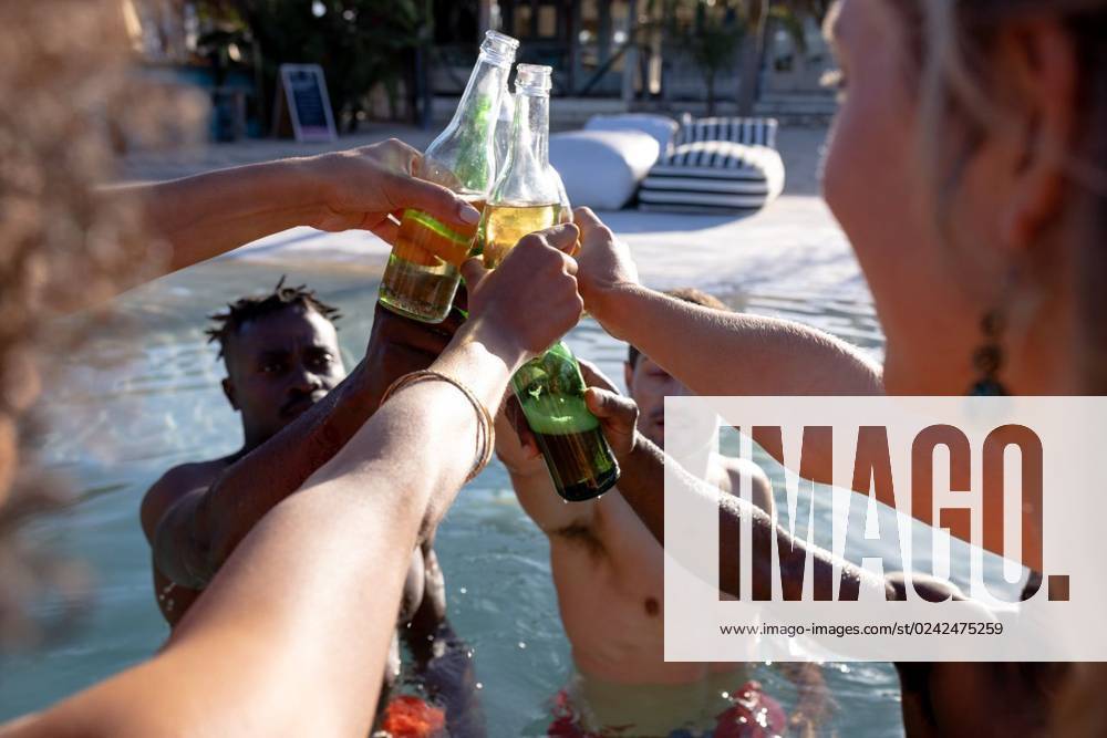 Happy diverse friends having party by swimming pool, making a toast Happy diverse friends having party by swimming pool, making a toast. Spending quality time, lifestyle, friendship, summertime and vacation concept., model released, , property released, Cape Town, South Africa, 21.02.2023, 3976715.jpg, people,happy,diverse,friend,swimming pool,making,toast,spending,quality time,lifestyle,party,friendship,summertime,vacation,concept,young,fun,holiday,person,leisure,happiness,together,smile,adult,cheerful,beautiful,summer,celebration,friends,portrait,smiling,cute,attractive,joy,swimming,pool,quality,time Young Adult,Woman,Female,White,Black,Multiracial,Mid Adult,Man,Male