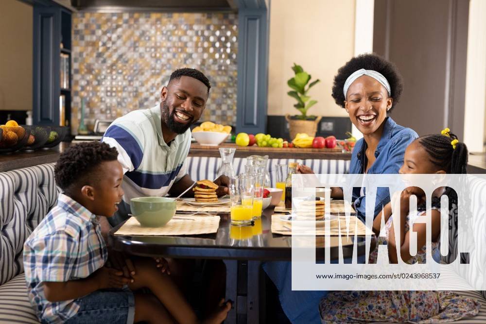 Cheerful african american parents and children talking while having breakfast at dining table Cheerful african american parents and children talking while having breakfast at dining table. Unaltered, family, togetherness, childhood, lifestyle, food, healthy, happy and home concept., model released, , property released, Cape Town, South Africa, 2023-01-25T22:00:00.000Z, 4008827.jpg, people,cheerful,african american,parent,child,talking,breakfast,dining table,unaltered,family,togetherness,childhood,lifestyle,food,healthy,happy home,concept,kid,happy,mother,young,happiness,together,little,fresh,fun,daughter,smiling,person,health,smile,adult,drink,joy,leisure,cute,african,american,dining,table,home Child,Boy,Male,Black,Young Adult,Man,Girl,Fem
