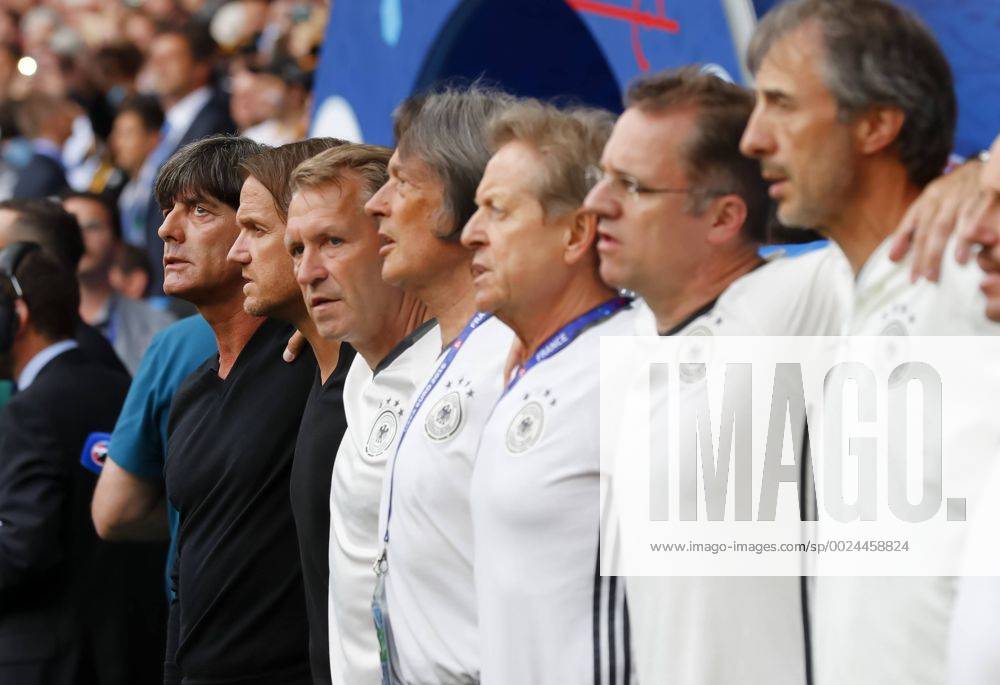DFB Bundestrainer Joachim Jogi LOEW, LÖW,Thomas SCHNEIDER, DFB Co-Trainer, AssistenztrainerAndreas KOEPKE , Torwarttrainer DFB Dr. Hans-Wilhelm Müller-Wohlfahrt, DFB Mannschaftsarzt, Klaus EDER, DFB Physiotherapeut singt, singen Hymne, Nationalhymne, Song, Deutschlandlied GERMANY - SLOVAKIA 3-0 Best of 16 ,Football European Championships EURO at 26th of June, 2016 in Lille, France. Fussball, Nationalteam,Deutschland, Slowakei, Achtelfinale