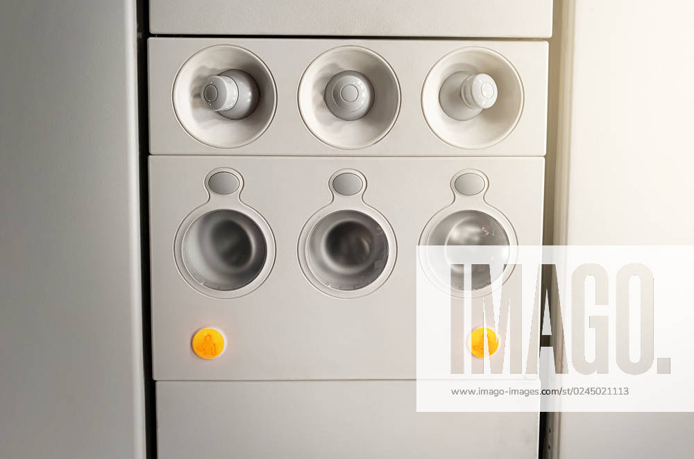 Adjustable lights and air conditioners overhead seat controls of a commercial aircraft in an airplane Adjustable lights and air conditioners overhead seat controls of a commercial aircraft. Closed air conditioners nozzles