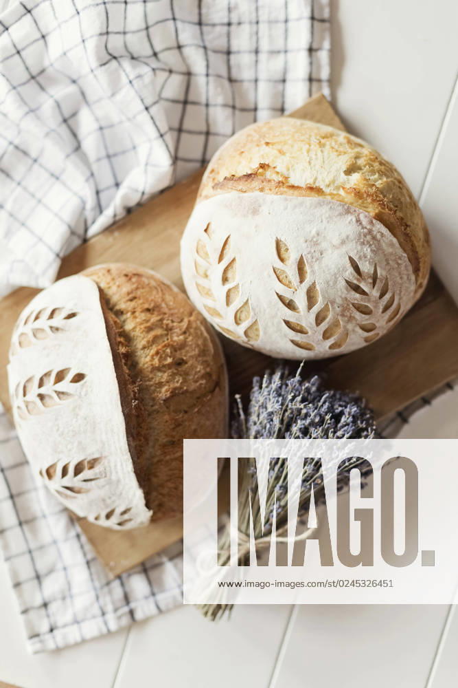 Freshly baked bread with dry lavender flowers on table property released, ONAF00484