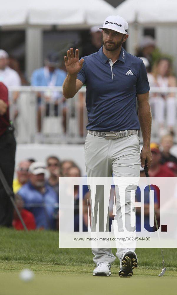 Akron, OH, USA - Winner Dustin Johnson acknowledges applause after leaving his putt on the cup lip on the 18th hole on the final day of the Bridgestone Invitational golf tournament on Sunday, July 3, 2016, at Firestone Country Club in Akron, Ohio. Johnson bogied the hole but won the tournament by one stroke. Bridgestone Invitational - ZUMAm67_