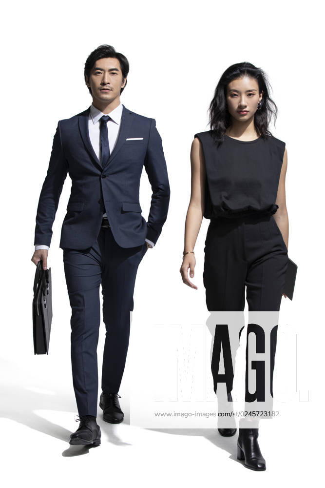 Confident Chinese business people walking Beijing China